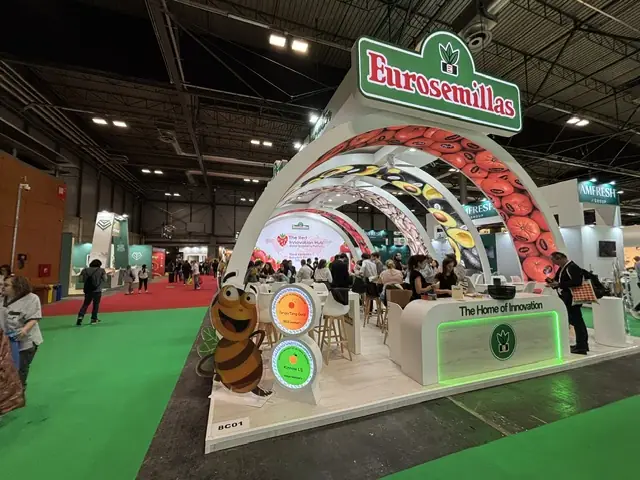 Eurosemillas stand with product-graphic arches, lit counter and bar